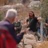 Israeli security forces and armed settlers evacuate activists from the area of olive tree plantation in Idna village near Hebron, on October 13, 2026.
