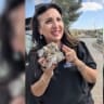 Screenshot taken from a video of Fleur Hassan-Nahoum, with her holding up the rock that was thrown through her car window while touring the West Bank.