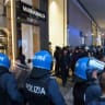 Italian police face a crowd during a protest over the state of public services and the rising cost of living in Milan, Italy, October 18, 2026.