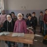 Schoolchildren attend class at the Zamalka mixed school on April 16, 2025 in the village of Jobar, on the outskirts of Damascus, Syria; Illustrative.