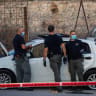Israeli police inspectors and bomb squad unit are seen at the scene where Israeli Border Police forces shot at a driver who allegedly attempted to ram his vehicle into security personnel in az-Za'ayyem checkpoint near Ma’ale Adumim.