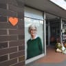 Tributes and flowers outside the electoral office of independent Australian lawmaker Helen Haines, who was deliberately struck by a car outside her office on Monday, in Wangaratta, Australia, October 20, 2026.