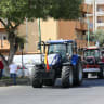 Tractors drive past a petrol station during a farmers' protest against high fuel and production costs, in Gela, Sicily, Italy, October 3, 2026.
