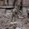 Syrian forensic team members search rubble at the collapsed Jakkak Building in Raqqa, Syria, in November 7, 2024, according to SJAC.