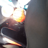 The floor of the car in which a toddler was trapped is seen in this screenshot from a video of his rescue, in which broken car window glass is seen alongside a child's toy. 