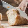Slicing a bread. 