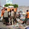 Workers collect garbage from a street in the southwestern city of Taiz, Yemen, October 20, 2026.