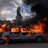A car is set ablaze during demonstrations on October 17, 2026 in Paris, France.