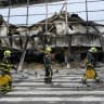  UKRAINE-RUSSIA-CONFLICT-WAR Ukrainian rescuers walk at the site of a shopping centre damaged following a missile strike in Kyiv on October 22, 2026, amid the Russian invasion of Ukraine.