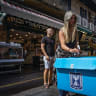 People participate in a street poll ahead of the election, in Mahaneh Yehuda last week.
