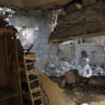 People inspect damage at a house reportedly hit by a Houthi missile in the southwestern city of Taiz, Yemen October 21, 2026.