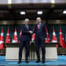 Turkish President Tayyip Erdogan and Canadian Prime Minister Mark Carney shake hands during a press conference at the presidential palace in Ankara, Turkey, October 22, 2026.