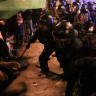 Demonstrators clash with riot police at a protest calling for political action to address Spain's housing crisis in Barcelona, Spain, October 5, 2026.