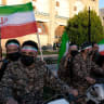 A group of Basiji (mobilized militia) men in military fatigue and armed seen in the middle of Naqsh-e Jahan Square mounted on their motorcycles on the occasion of Imam Reza's birthday while holding Iranian flags with images of the new Supreme Leader Mojtaba Khamenei on April 29, 2026.