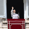 Pope Leo XIV waves to the crowd from the window of the apostolic palace overlooking St.Peter's Square after delivering his Sunday Angelus prayer at The Vatican on October 25, 2026. 