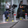 Israeli police and forensic investigators at the scene of a fatal shooting outside a bank on Moshe Dayan Street in Tel Aviv, where two men in their 50s were found shot dead. Police are investigating a suspected murder-suicide, October 26, 2026. 
