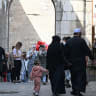Syrians walk past shops down an alley at the Old City in Damascus on October 21, 2026.
