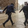 People walk near Jaffa Gate in Jerusalem’s Old City on a rainy day, October 24, 2026.