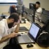 A Jewish man works in an office. 