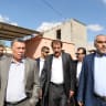 Chairman of the Palestinian Crossing Authority Nazmi Mhana (C) walks alongside Hamas leader Ghazi Hamad at the northern entrance of the Gaza Strip just after the Israeli-controlled Erez crossing, on November 1, 2017 in Beit Hanun.