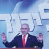 Prime Minister Benjamin Netanyahu addresses Likud supporters in Jerusalem after Tuesday's exit polls showed the Likud remaining as the largest party. 