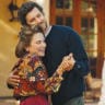 ADAM BRODY as Noah and Tovah Feldshuh as mother Bina share a moment on screen in ‘Nobody Wants This,’ while Joanne, played by Kristin Bell, looks on. 