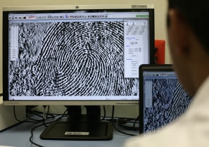  A fingerprint expert checks a fingerprint on a monitor at the attorney's general crime laboratory in Mexico City July 12, 2011.