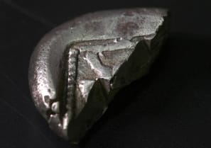  The rare coin, providing evidence for the development of commerce.