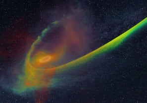 A star disrupted by a supermassive black hole. As the star wanders past the black hole, the tidal field of the hole rips apart the star. The picture shows the result of the simulation carried out by Steinberg and Stone.