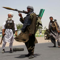Former Mujahideen hold weapons to support Afghan forces in their fight against Taliban, on the outskirts of Herat province, Afghanistan July 10, 2021.