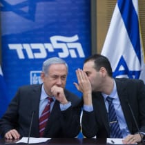 Prime Minis4er Benjamin Netanyahu and leader of the Likud party speaks with Miki Zohar during a Likud party meeting in the Israeli parliament on January 25, 2016