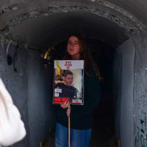  Families of Israelis held hostage by Hamas terrorists in Gaza standing outside a tunnel installation at Hostages Square in Tel Aviv on January 13, 2024
