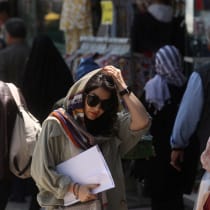  An Iranian woman walks on a street amid the implementation of the new hijab surveillance in Tehran, Iran, April 15, 2023