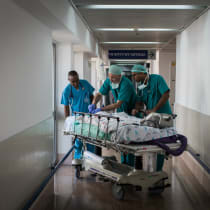 Doctors and nurses take two-year-old Zahran Khamis Haji to the emergency room for recovery after the infant underwent open-heart surgery at Wolfson Medical Center in Holon, Israel, on August 13, 2018. Uploaded on 6/5/2024