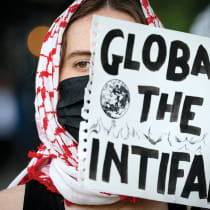  A demonstrator holds a placard as students from Columbia University protest outside the offices of University Trustees in New York City on May 7. 
