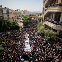       Family and friends attend the funeral service of druze children who were killed at a soccer field from a missile fired from Lebanon, in the druze village of Majdal Shams, in the Golan Heights, July 28, 2024.