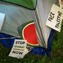  Signs lie next to a tent as pro-Palestinian students and faculty of Drexel University, Temple University and the University of Pennsylvania spend night where they erected an encampment at the University of Pennsylvania campus in Philadelphia on April 25, 2024. 