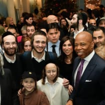  New York City Mayor Eric Adams (right) and guests at the mayor's annual Hanukkah celebration.