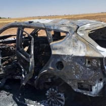 A burnt vehicle is pictured after, what medical and security sources say, was targeted by a Turkish drone strike in the village of Tal Shaeer, Syria June 20, 2023.
