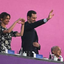  Syria's President Bashar al-Assad (C) and his wife Asma al-Assad (L) attend the opening ceremony of the 2022 Asian Games at the Hangzhou Olympic Sports Centre Stadium in Hangzhou in China's eastern Zhejiang province on September 23, 2023.