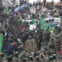  Palestinian Hamas terrorists gather as they prepare to release hostages who had been held in Gaza since the deadly October 7, 2023 attack, as part of a ceasefire and a hostages-prisoners swap deal between Hamas and Israel, in Gaza City, January 25, 2025, in this screen grab from a video.