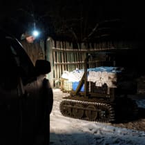 Ukrainian servicemen operate an unmanned ground vehicle fit for delivery missions on the frontline in Donetsk region