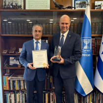 Ahmed Charai presents Knesset Speaker Amir Ohana with the Abraham Leadership and Public Service Award.