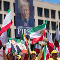 Iranian Americans and supporters of the National Council of Resistance of Iran take part in a march passing in front of the U.S Department of Labor building with a banner with the image of U.S. President Donald Trump, in Washington, DC, US, May 16, 2026.