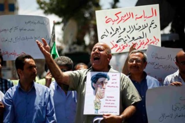 Palestinian protester against John Kerry 370 (photo credit: REUTERS/Mohamad Torokman)
