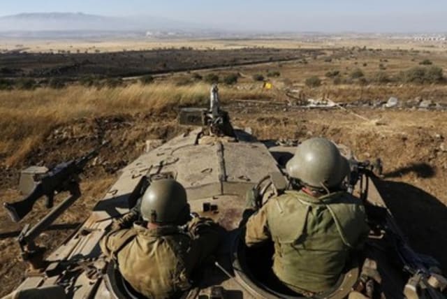 IDF soldiers sitting in tank 390