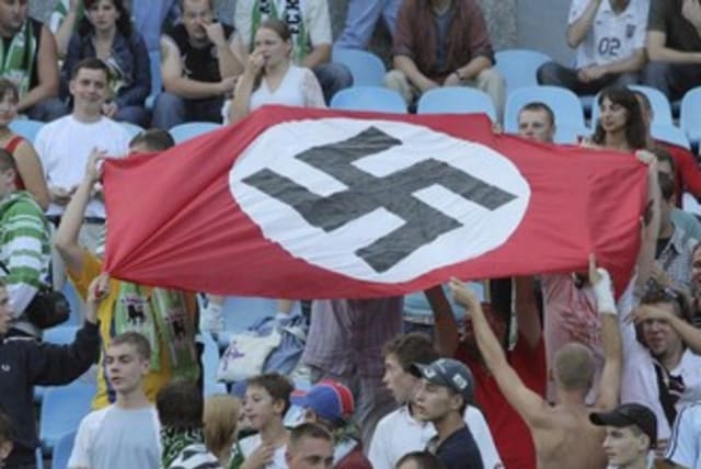 Soccer fans hold up Nazi swastika flag 370 (photo credit: REUTERS)
