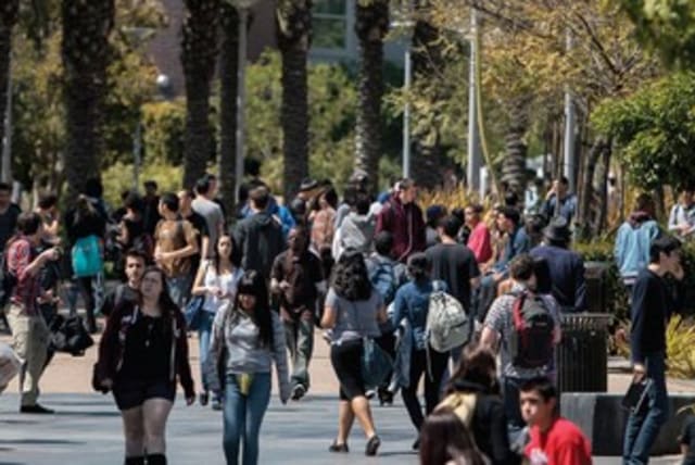 AMERICAN STUDENTS walk between classes at Santa Monica College in Santa Monica, California. (photo credit: REUTERS)