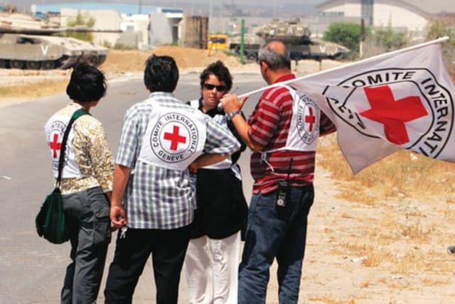 Members of the International Committee of the Red Cross stand near Erez Crossing in 2007. (photo credit: REUTERS)