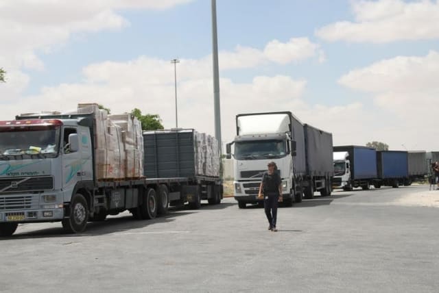 ISRAELI TRUCKS head into the Kerem Shalom crossing point yesterday with goods bound for the Gaza Strip (photo credit: TOVAH LAZAROFF)
